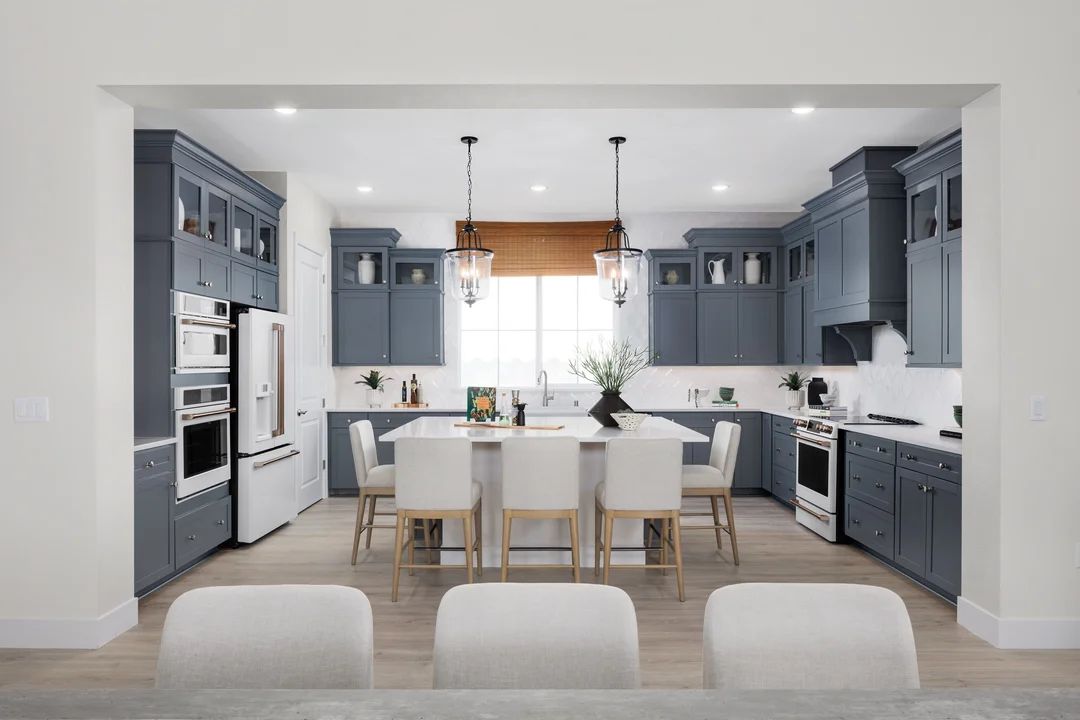 Kitchen with pendant lighting and glass upper cabinets