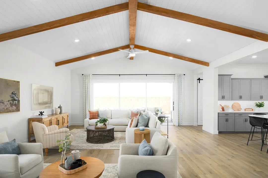 Great room with vaulted ceiling and stained ceiling beams