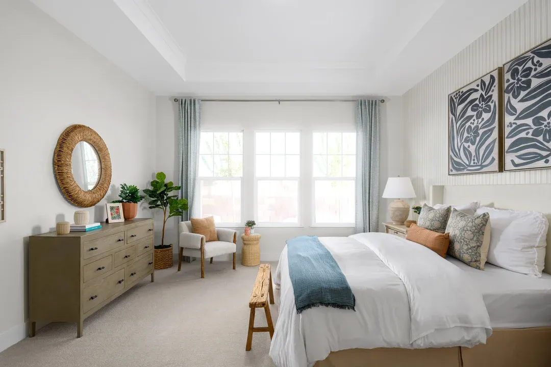 Primary suite with tray ceiling and crown moulding