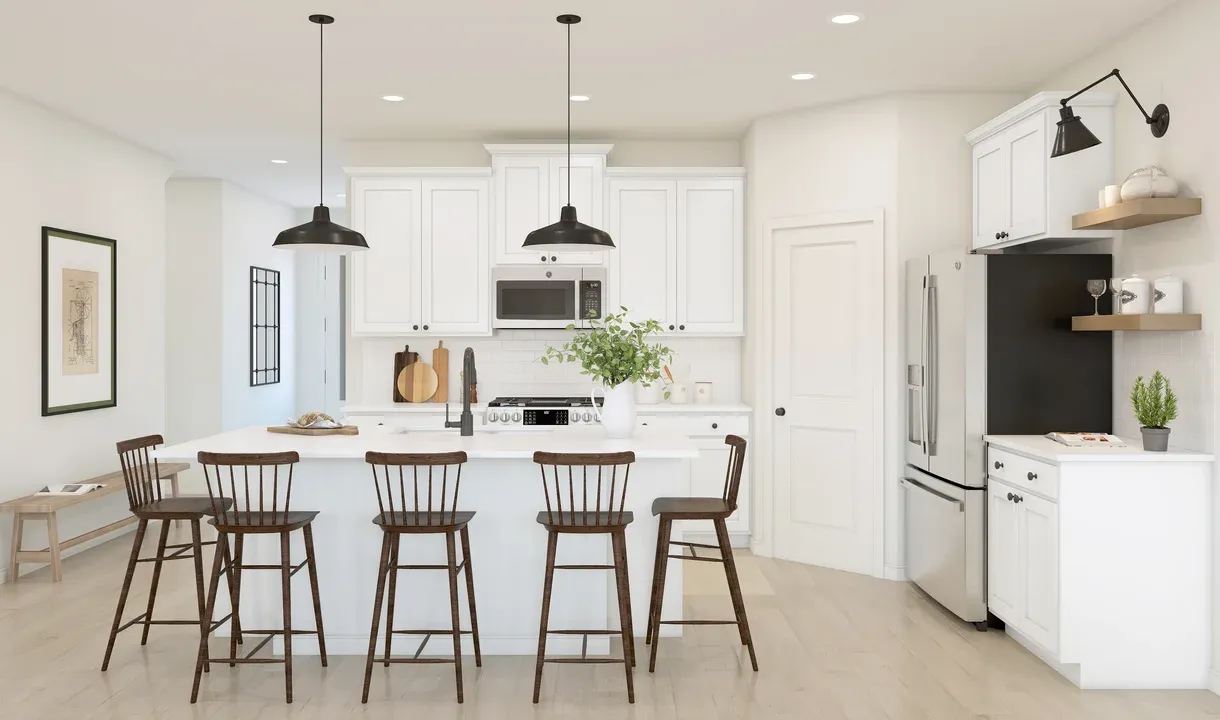 Kitchen with pendant lights and white cabinets