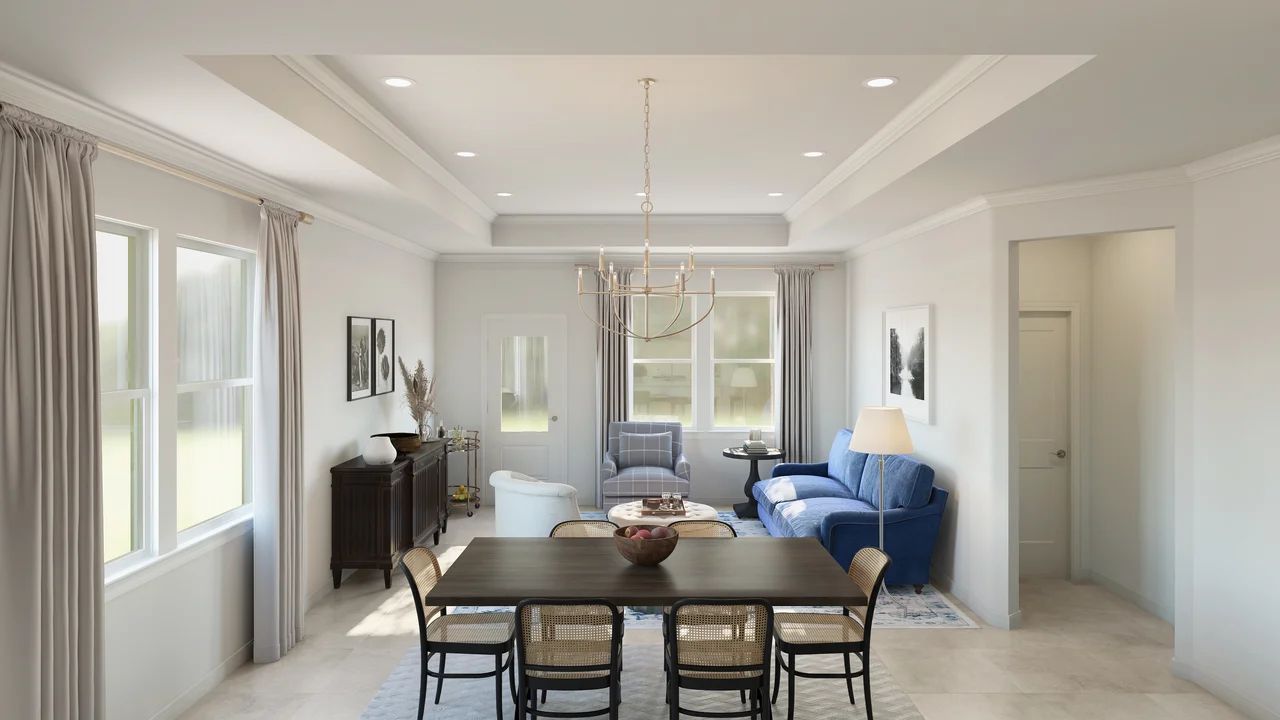 Great room with crown moulding and chandelier