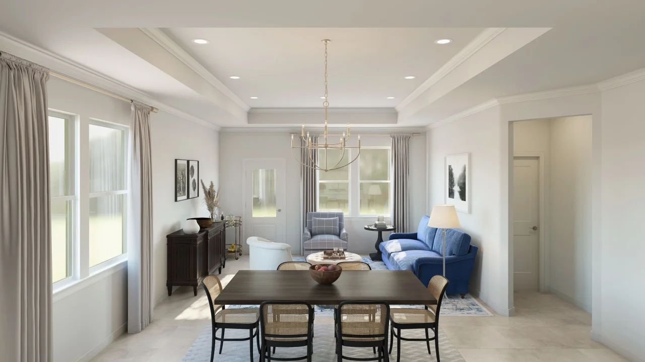Great room with crown moulding and chandelier