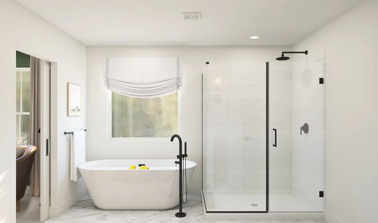 Primary bath with freestanding tub & glass-shower enclosure