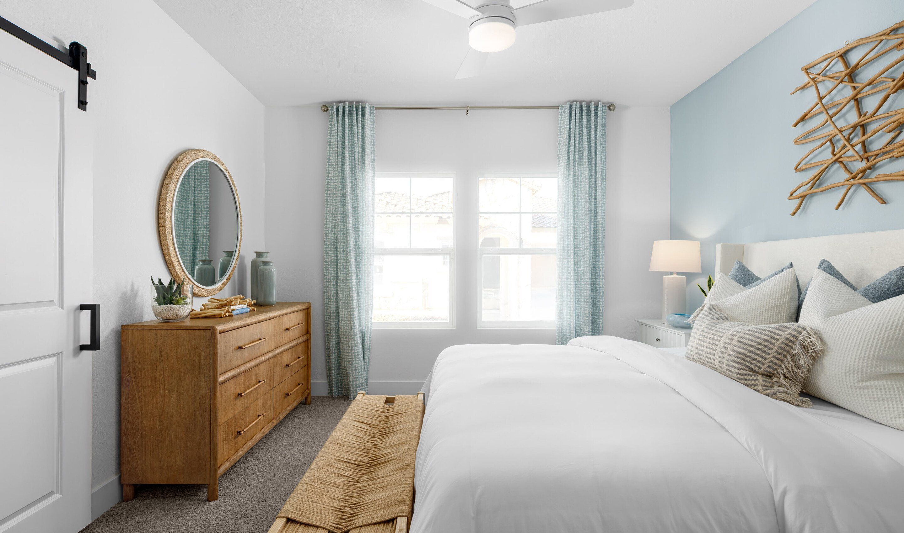 Primary suite with barn door to the primary bath
