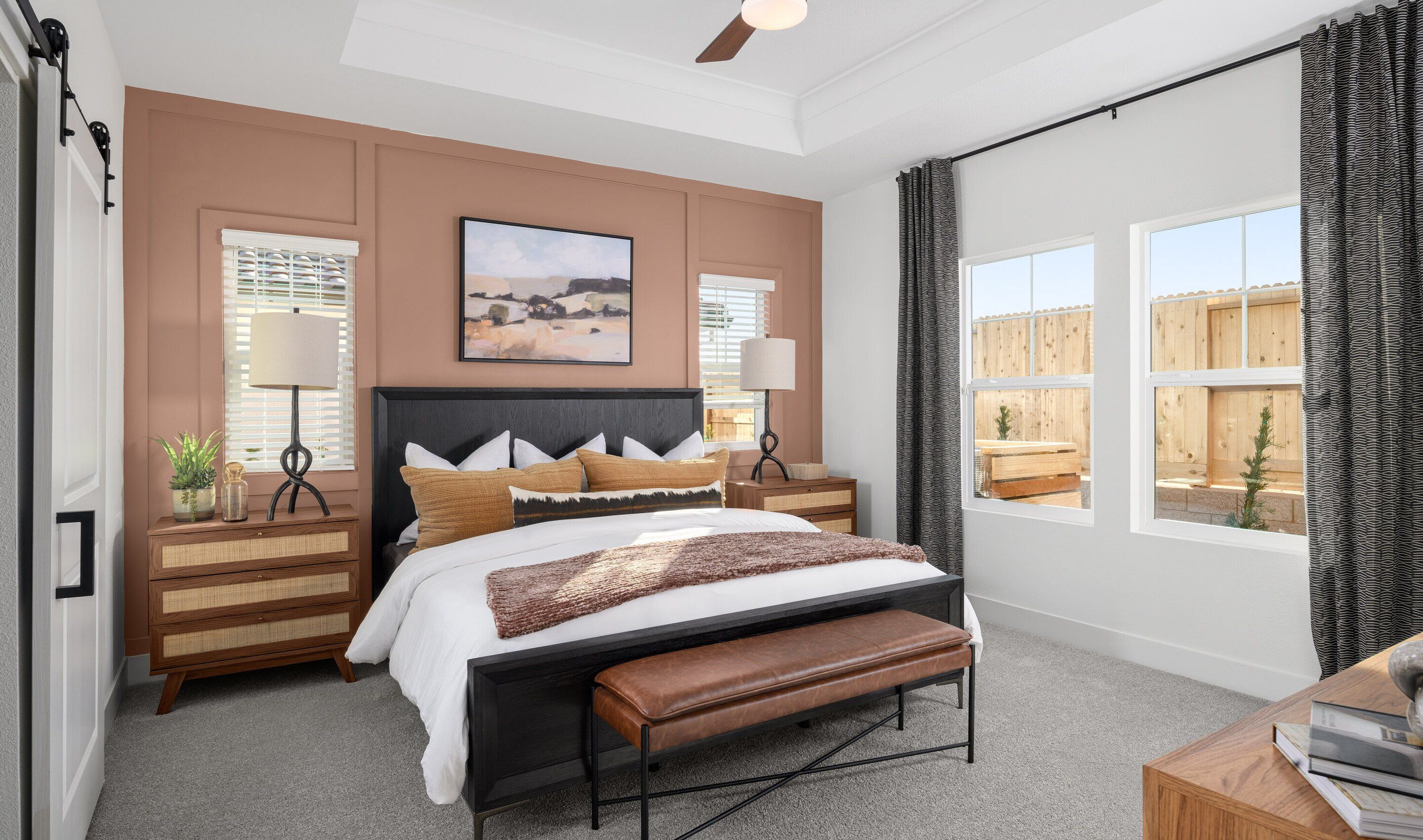 Primary suite with decorative feature wall