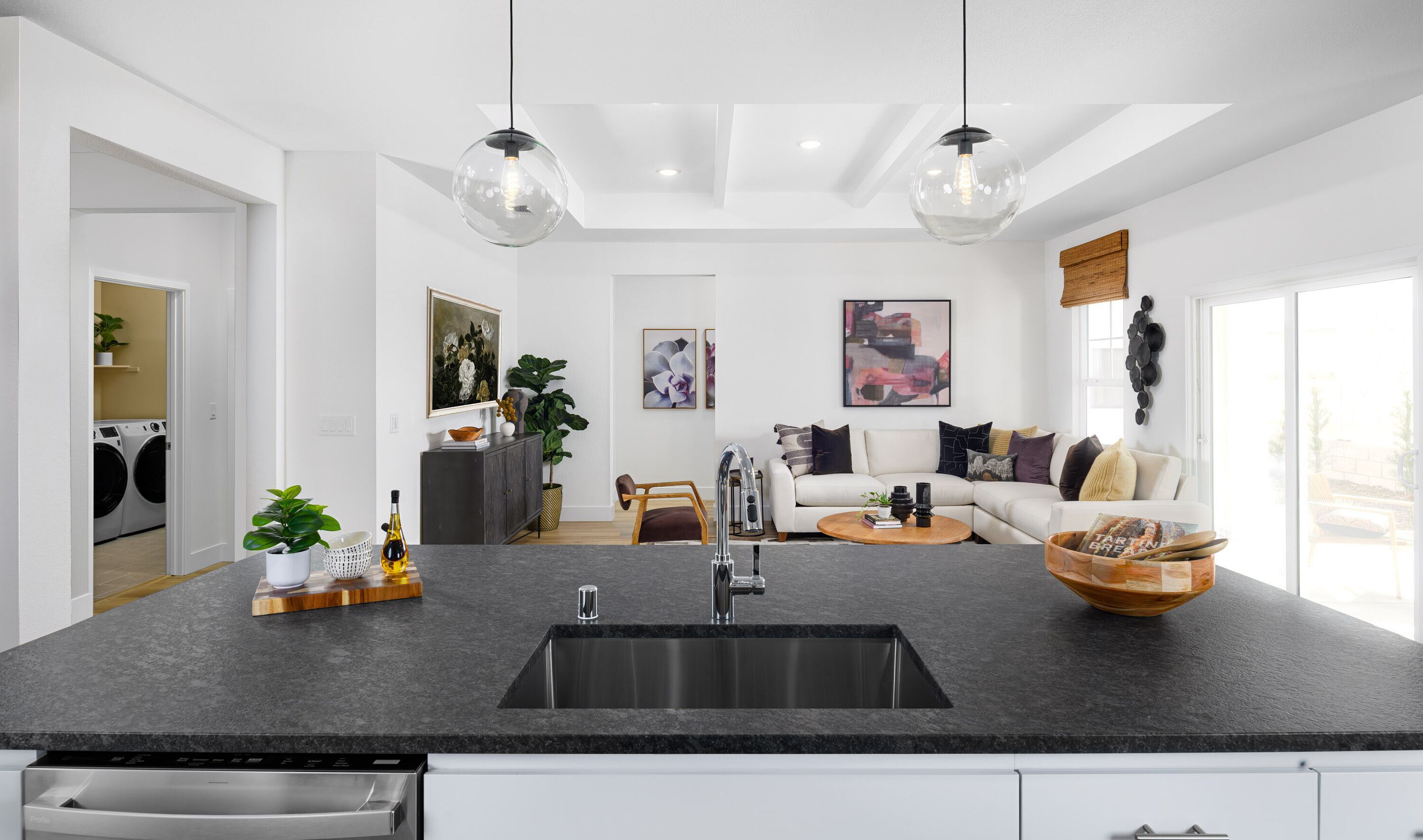 Kitchen with undermount stainless steel sink and pendant lighting