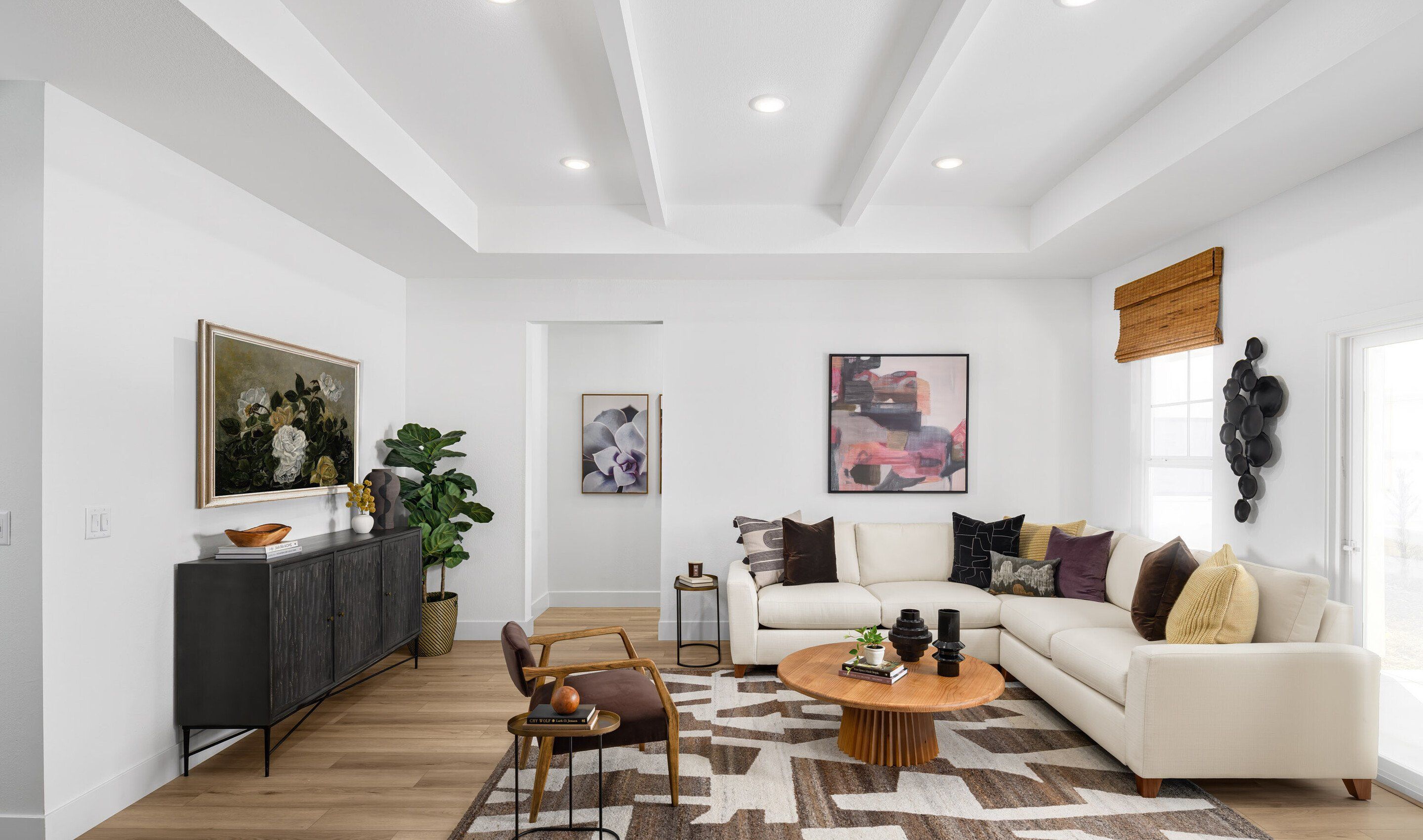 Great room with white painted ceiling beams