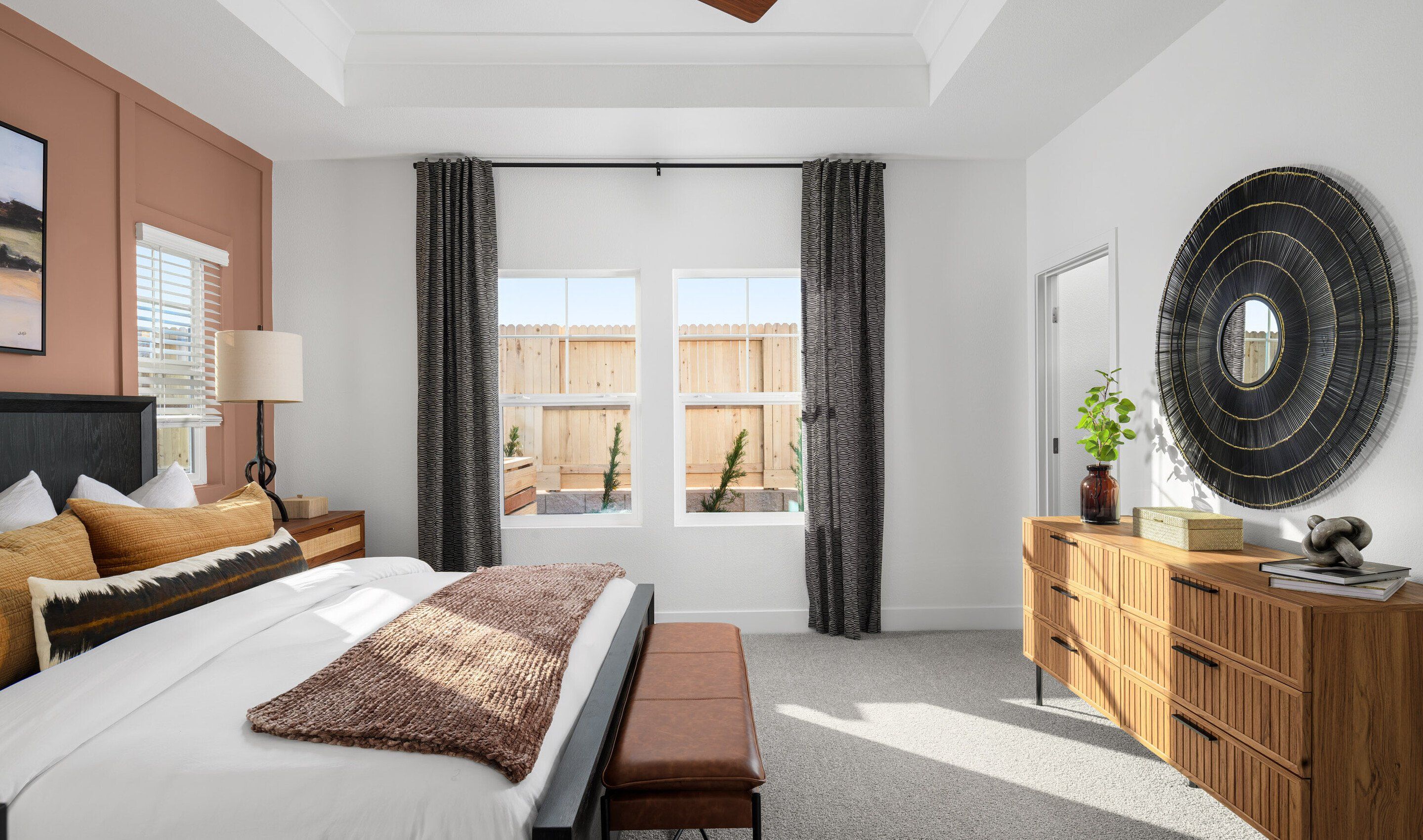 Primary suite with plush carpeting and private bath