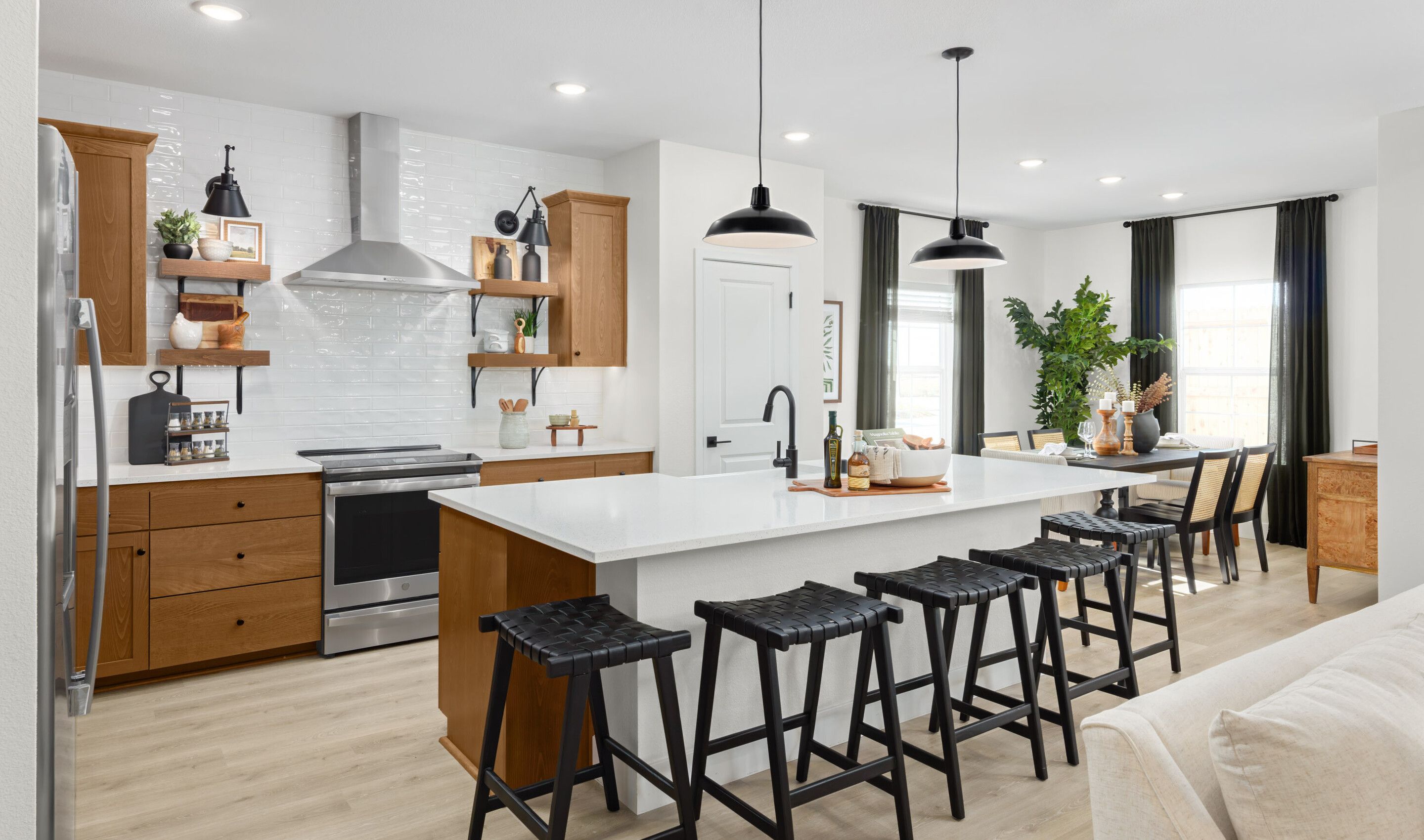 Kitchen with pendant lighting and floating shelves