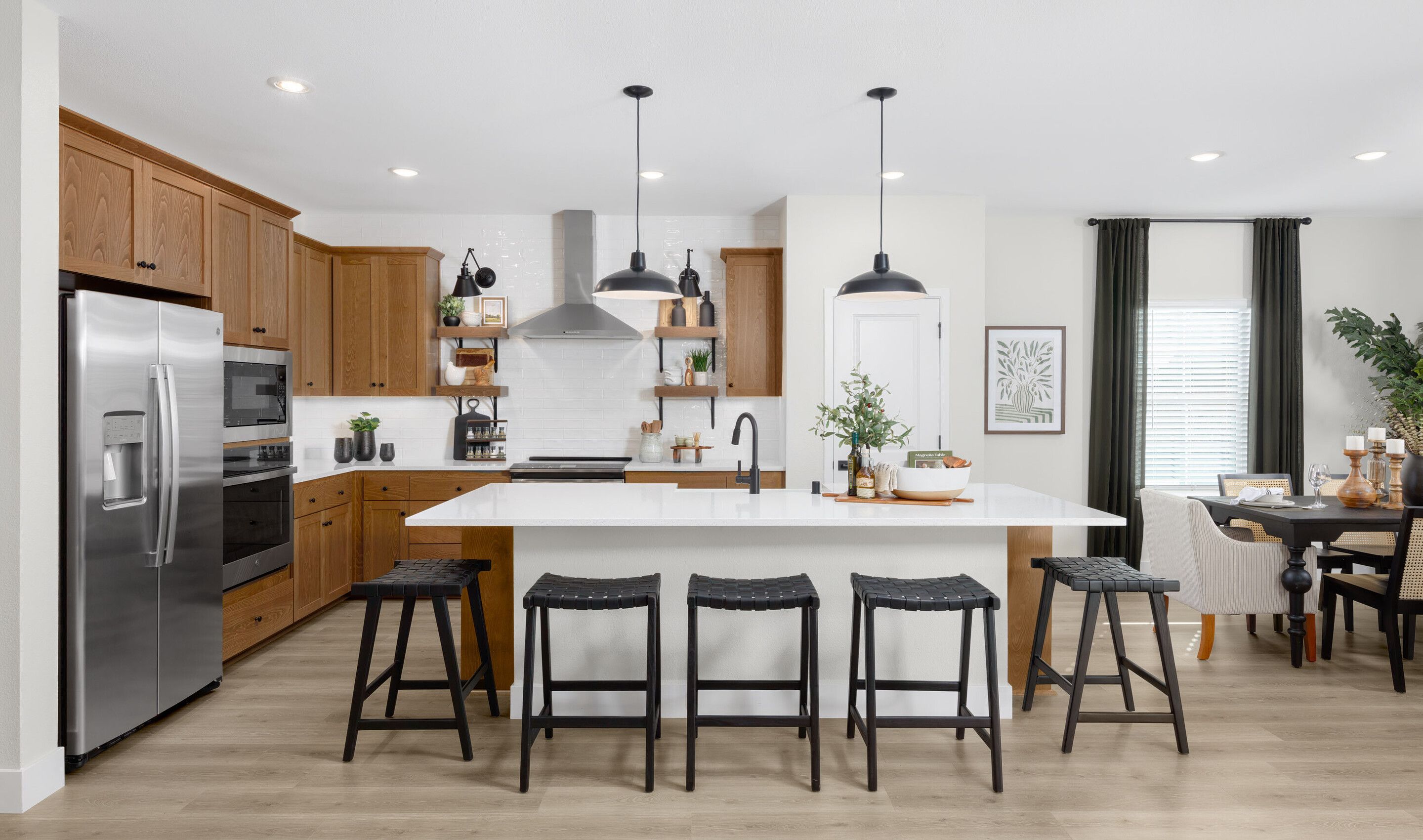 Kitchen with floating shelves and pendant lighting