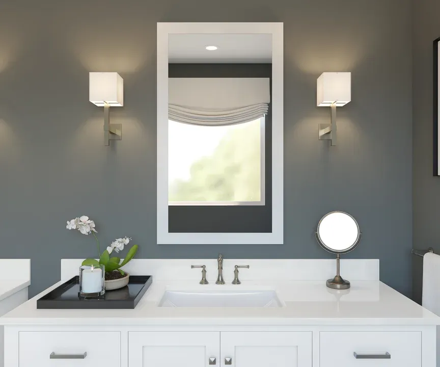 Primary bath with white-framed mirror
