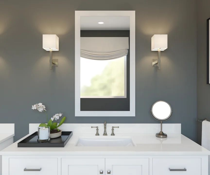 Primary bath with white-framed mirror