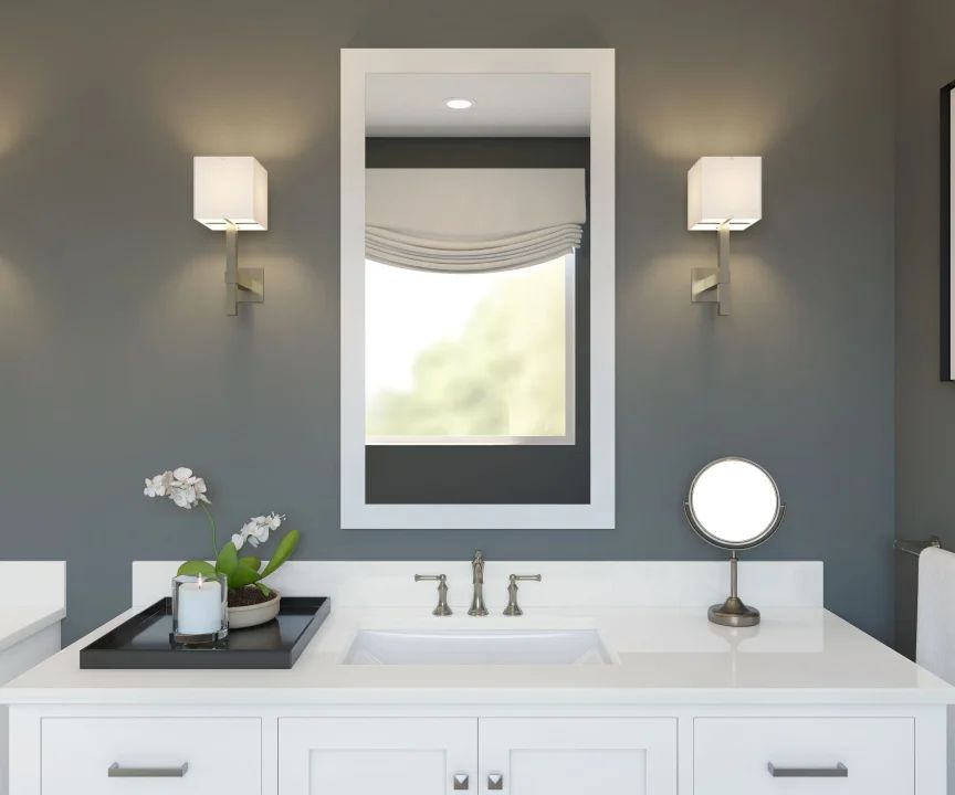 Primary bath with white-framed mirror