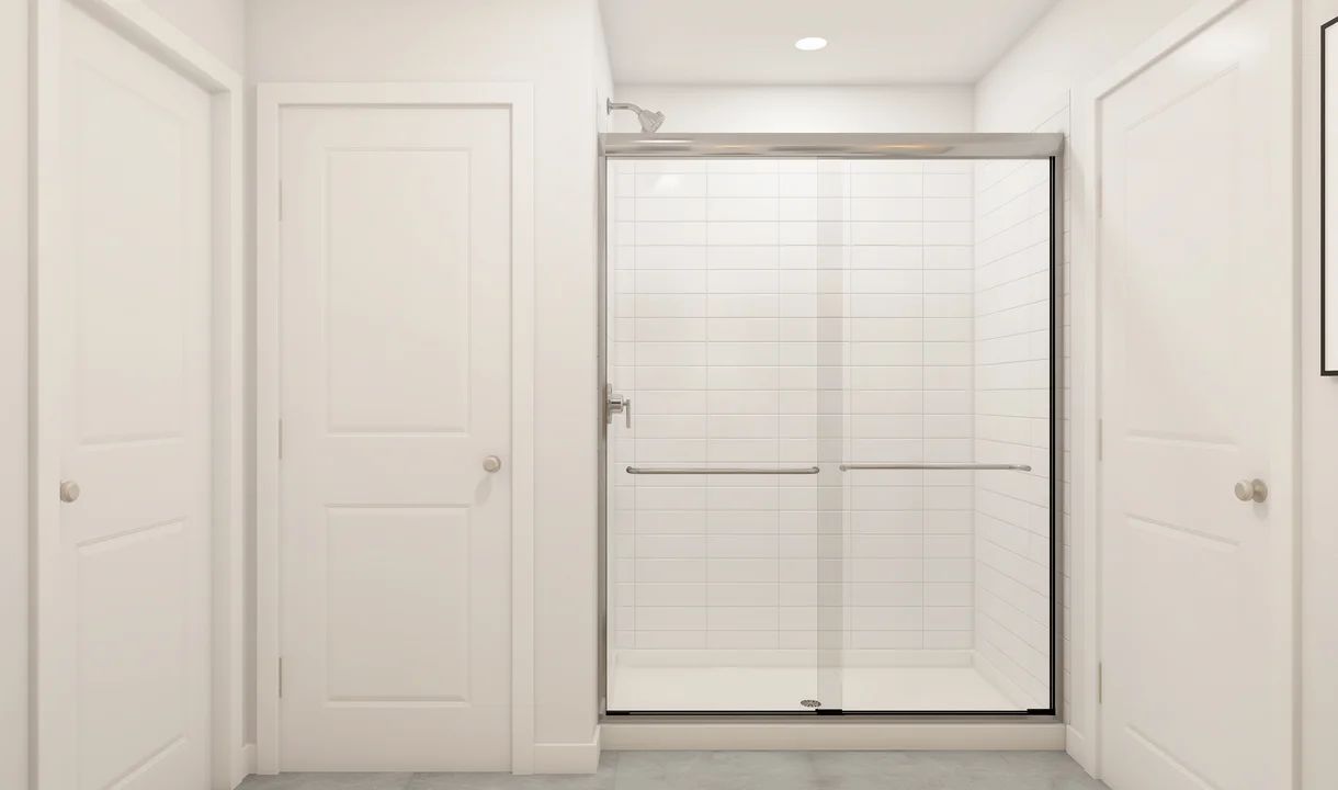 Primary bath with glass shower enclosure
