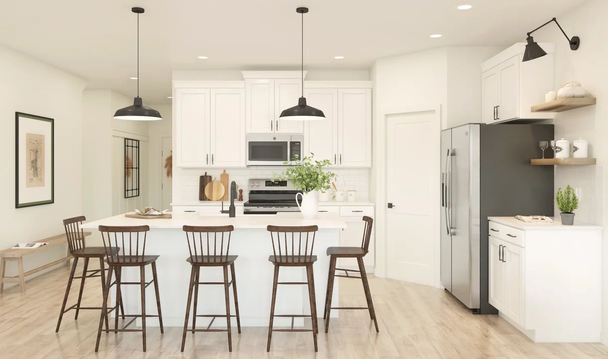 Kitchen with vast island and pendant lights