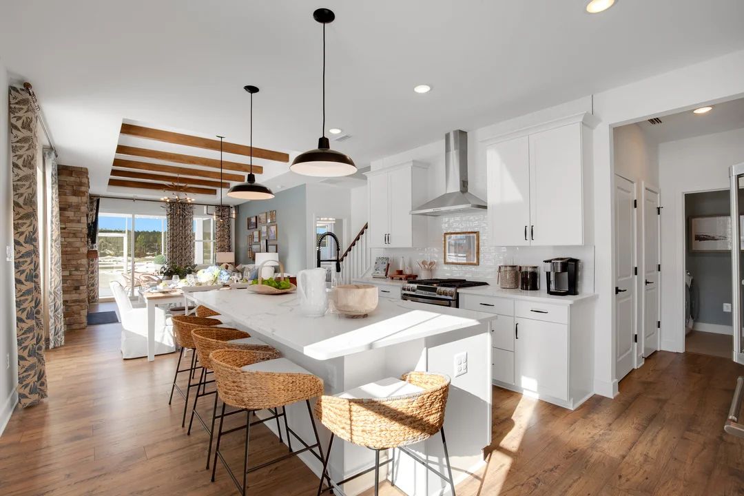 Kitchen features white cabinetry