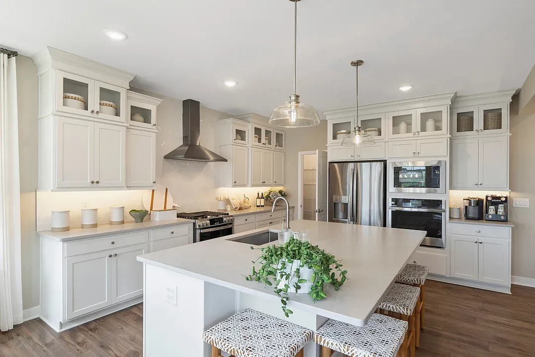 Kitchen features quartz island and countertop
