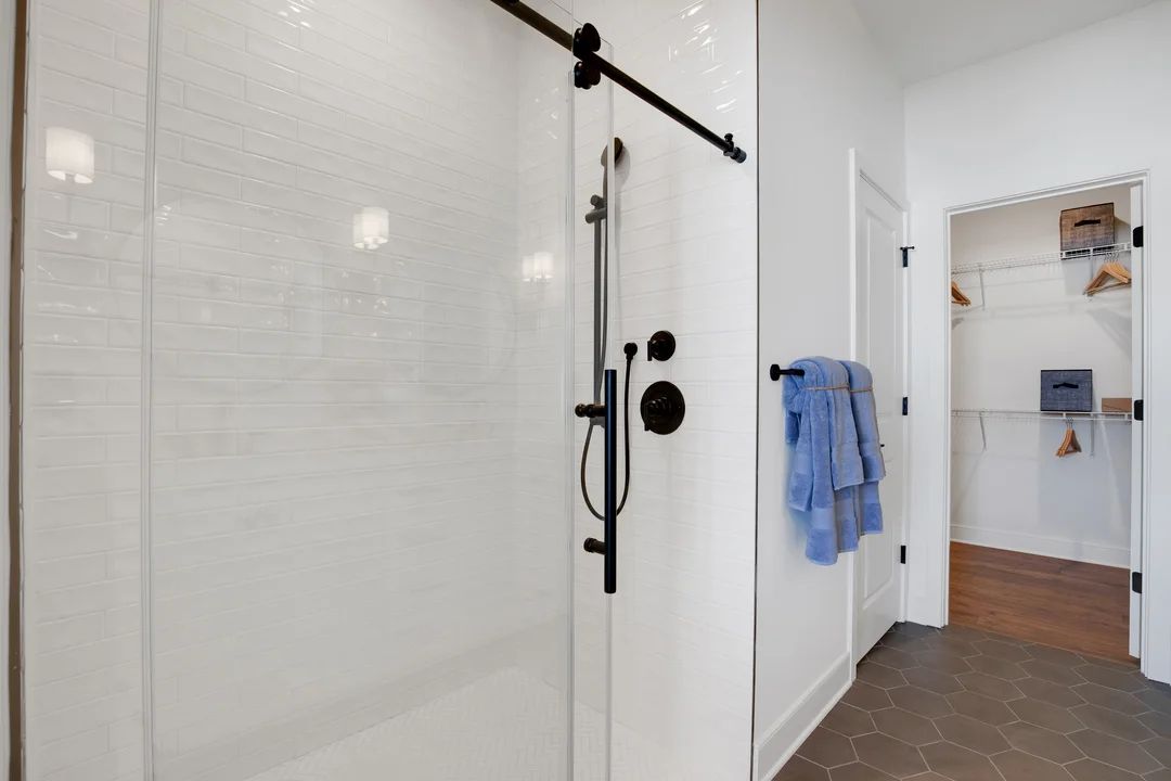 Primary bath with glass shower enclosure