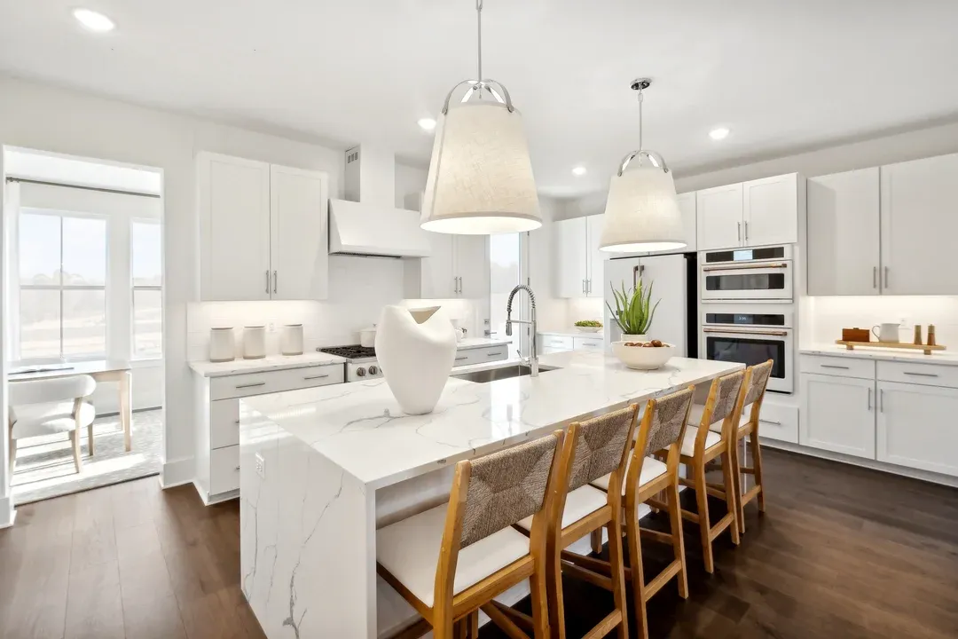 Kitchen with pendant lights and vast island