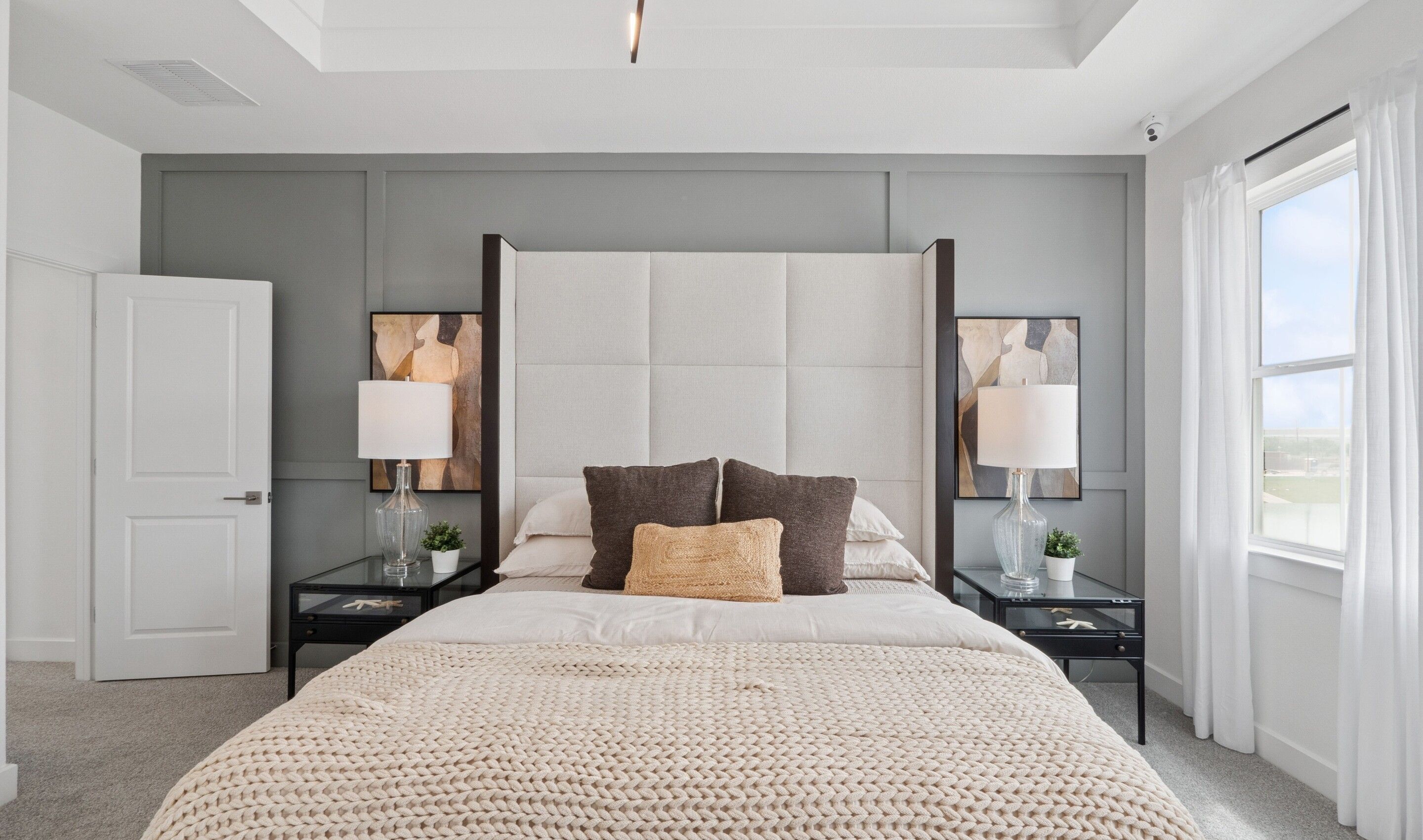 Primary suite with decorative feature wall