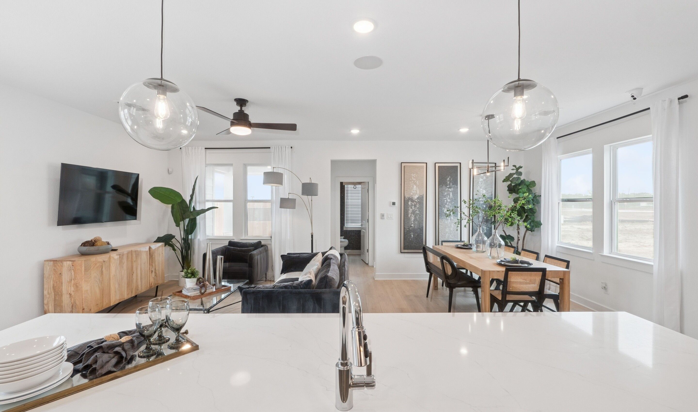 Kitchen with sleek pendant lighting