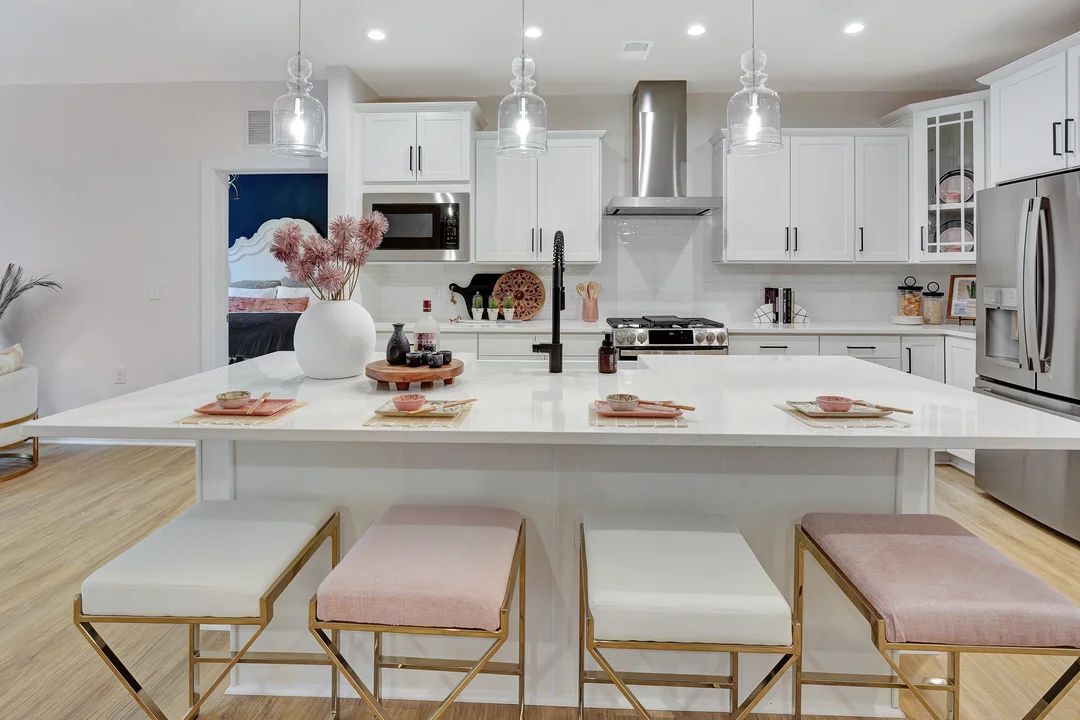 Kitchen with vast island and pendant lights