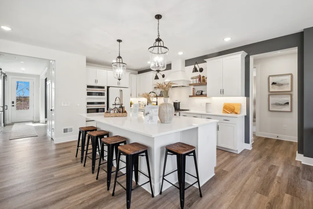 Kitchen with vast island and pendant lights