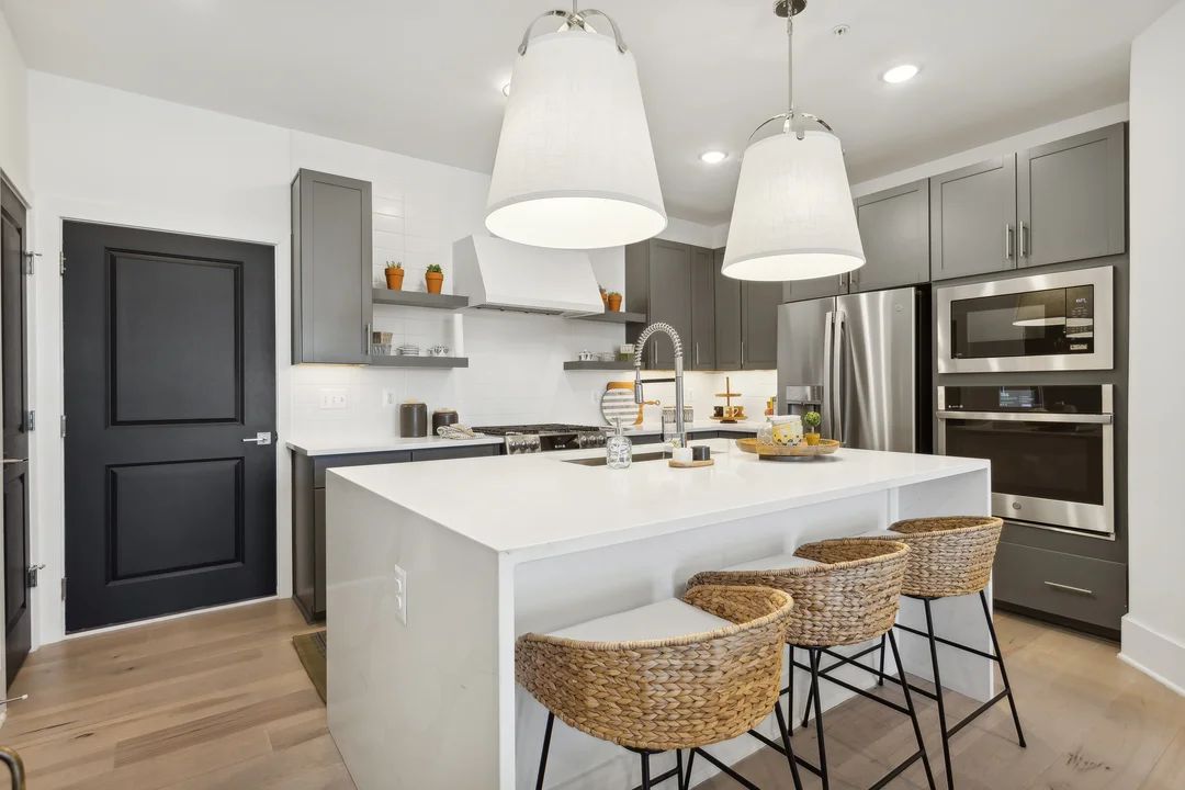 Kitchen with vast island and pendant lights