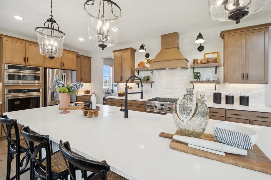 Kitchen with vast island and pendant lights