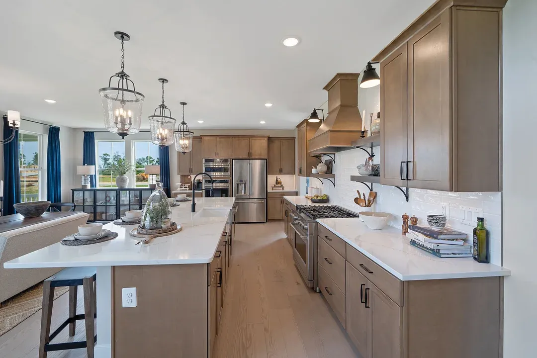 Kitchen with dark stained cabinets and matte black hardware