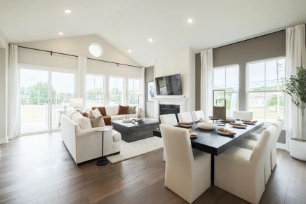 Soaring vaulted ceiling unites great room and dining area
