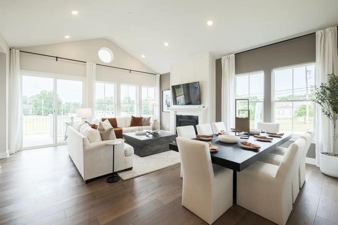 Soaring vaulted ceiling unites great room and dining area
