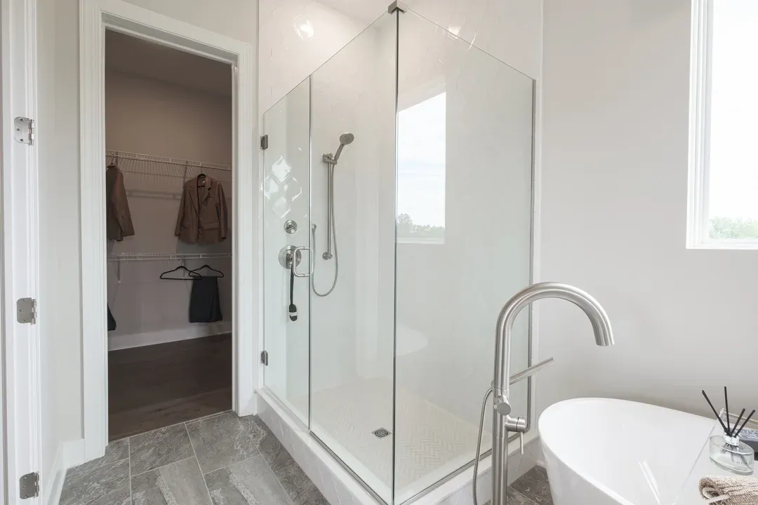 Primary bath with glass shower enclosure