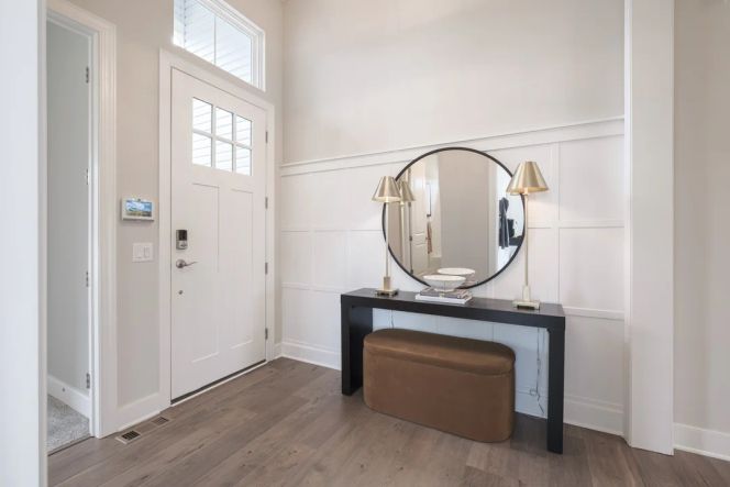Foyer with decorative feature wall creates a grand entrance