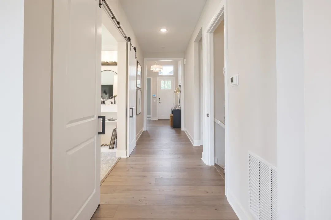 Foyer with charming sliding barn doors to home office