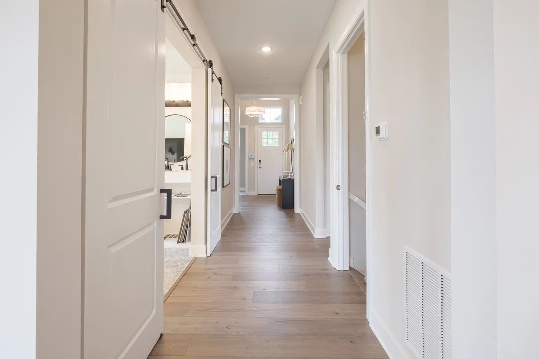 Foyer with charming sliding barn doors to home office