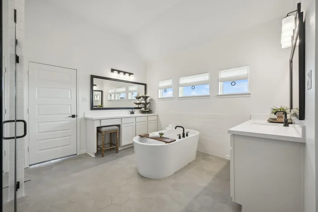 Primary bath with dual vanities and freestanding soaking tub