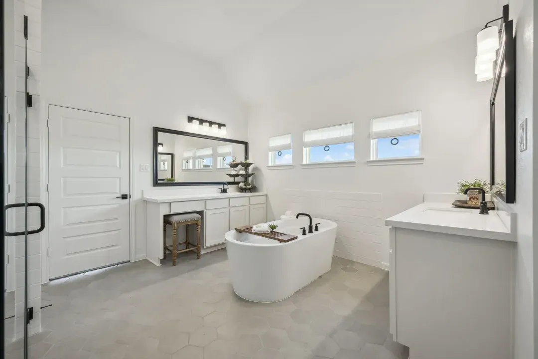 Primary bath with dual vanities and freestanding soaking tub