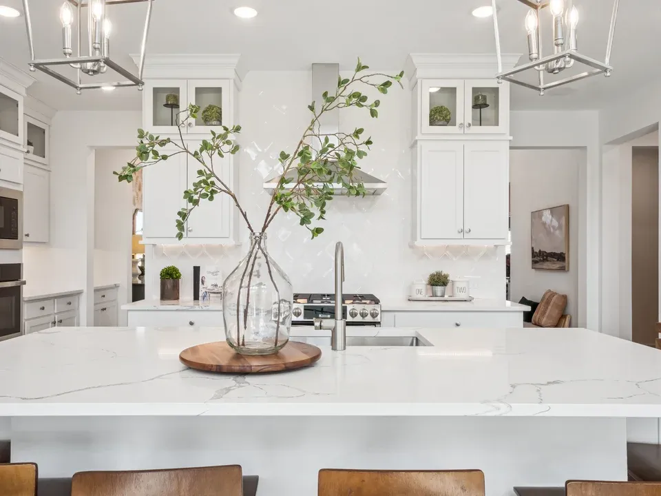 Kitchen with elegant stacked glass-front upper cabinets