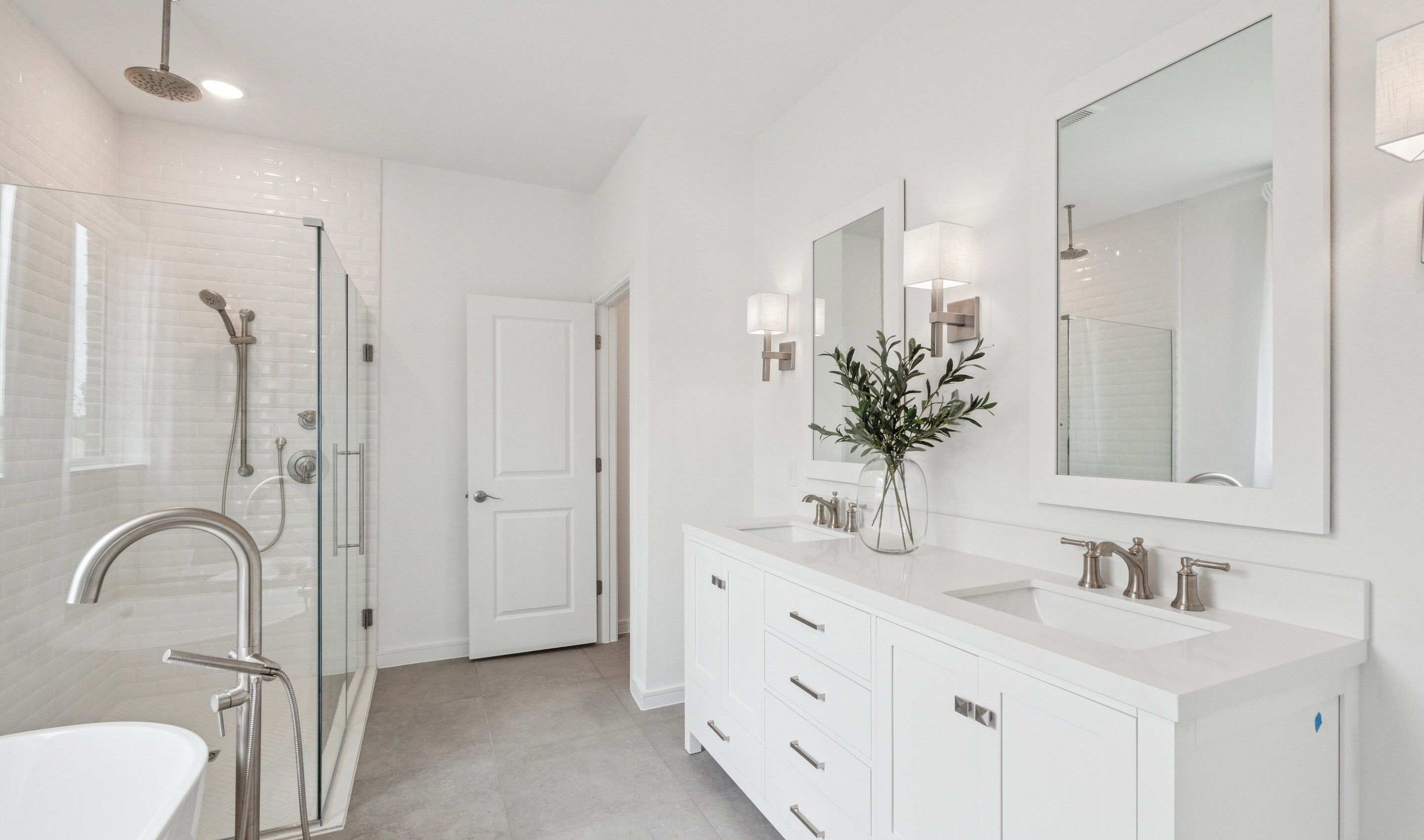 Primary bath with glass shower enclosure & brushed nickel accents