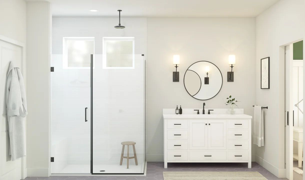 Primary bath with glass shower enclosure and matte black fixtures