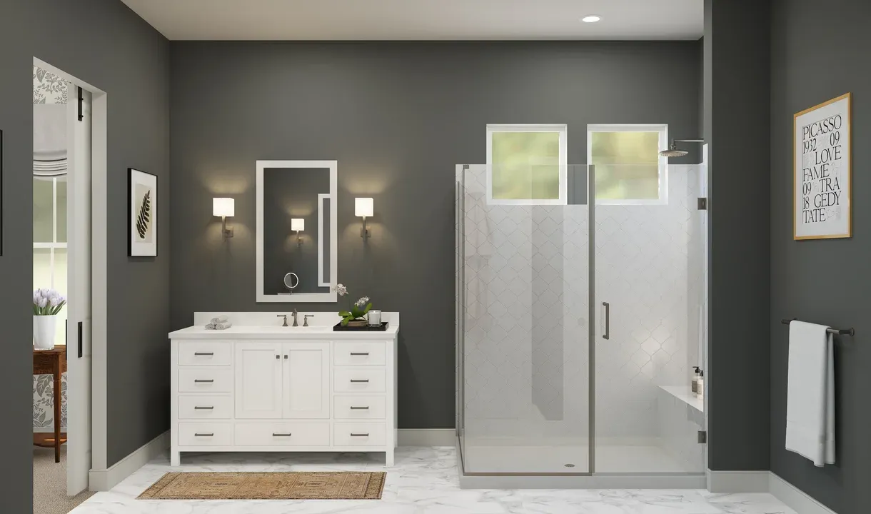 Primary bath with glass shower enclosure and vanity