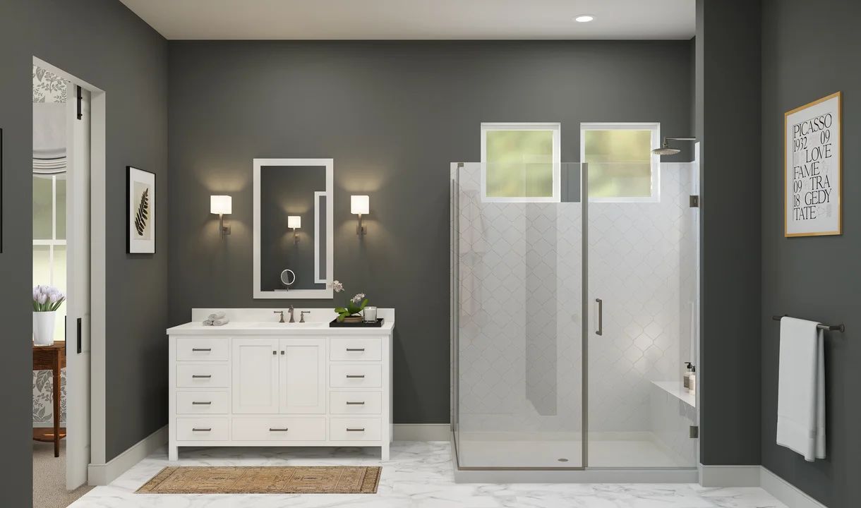 Primary bath with glass shower enclosure and vanity