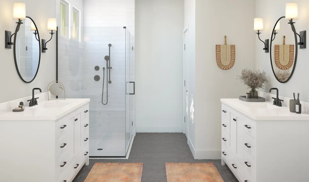 Primary bath with dual vanities and glass shower enclosure