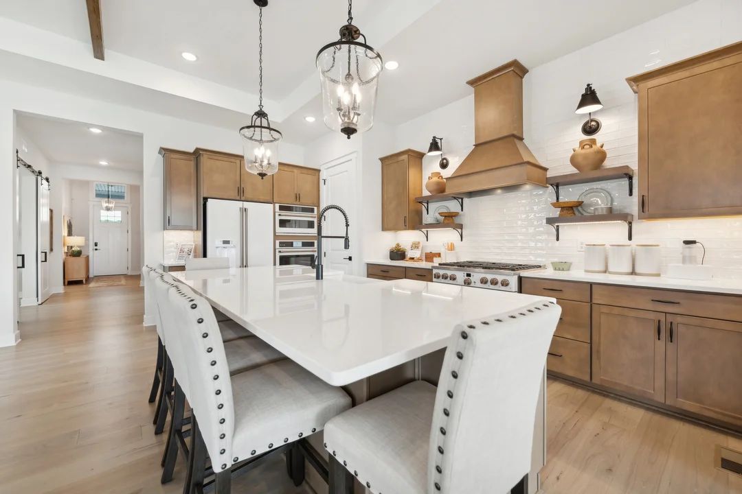 Kitchen with vast island and pendant lights