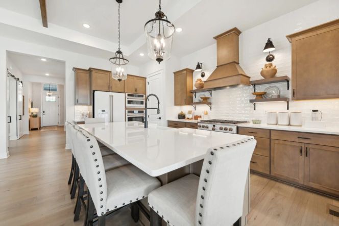 Kitchen with vast island and pendant lights