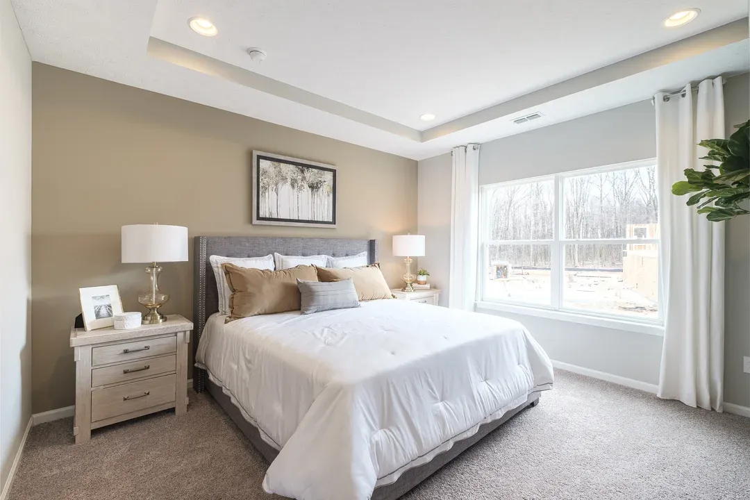 Owner's suite with plush carpeting and ceiling treatment