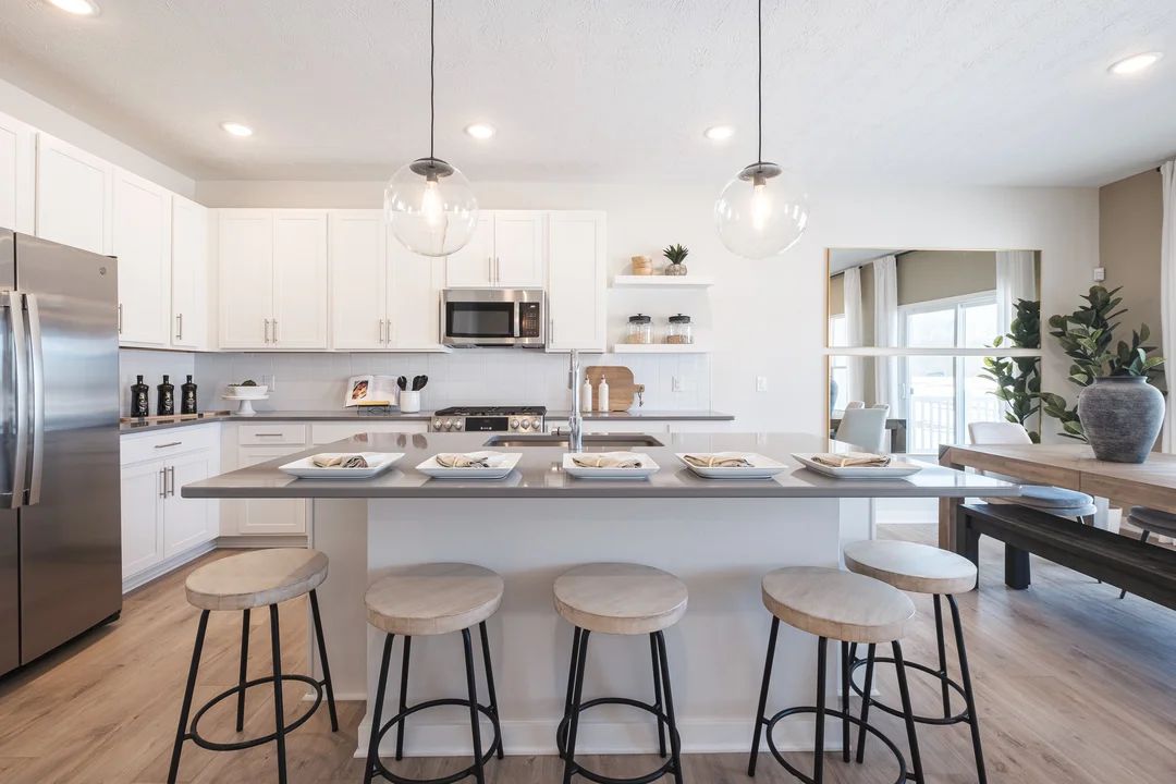 Kitchen with vast island and floating shelves