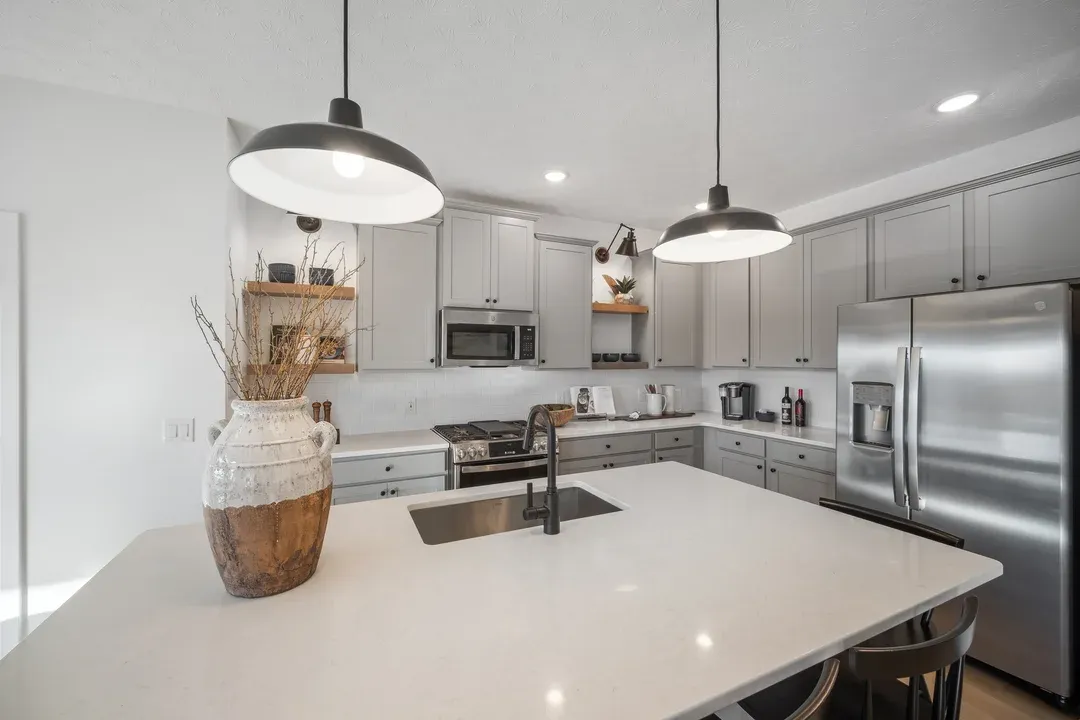 Kitchen with floating shelves & quartz countertops
