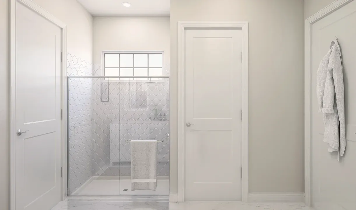 Primary bath with glass shower enclosure